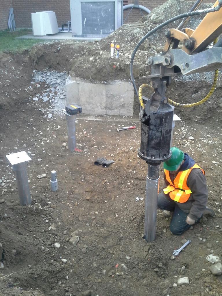 GoliathTech Helical Screw Pile metal post foundations for a Cell Tower support